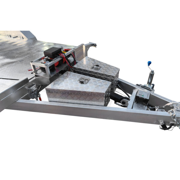 Close-up of a hydraulic tipper car trailer with a diamond-patterned toolbox, mechanical connections, and jack on the right. It has a 3500KG ATM and is mounted on a 16.4x6.6FT (5x2M) flatbed deck. Background is plain white.