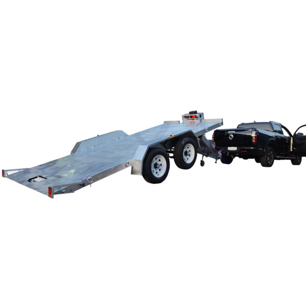 A black pickup truck is hitched to a silver Hydraulic Tipper Car Trailer, featuring a 16.4x6.6FT (5x2M) deck and two wheels on each side. The trailer’s rear is angled downwards, indicating a loading position against a plain white background.