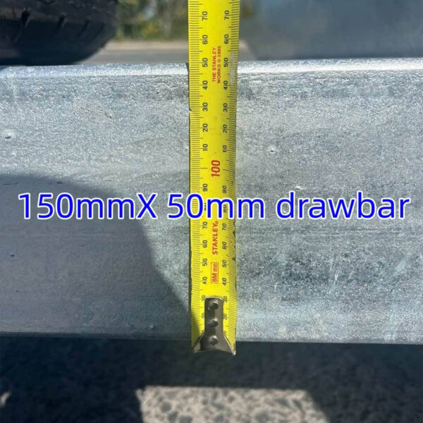 A tape measure hangs vertically on a metal drawbar, showing a width of approximately 80mm, with blue text reading 150mmX 50mm drawbar over what seems to be concrete. Product: Dual Axle Premium 3200KG Car Trailer with Spacious 15.7x6.6FT (4.8x2M) Deck.