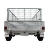 A rear view of the 8×5 Dual Axle Hydraulic Tipper Tandem Box Trailer (3500KG ATM) with wire mesh top, diamond plate surface, two wheels, red side reflectors, and XTREME on the mud flaps is shown.
