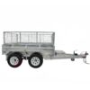 A silver metal 8×5 dual axle hydraulic tipper tandem box trailer (3500KG ATM) with mesh cage, dual wheelsets, tow hitch, and ramp holders appears empty against a plain white background.