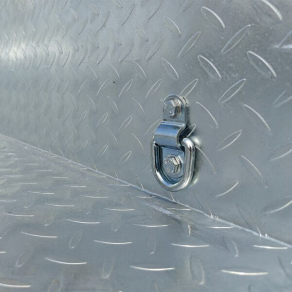 Close-up of the 8×5 Dual Axle Hydraulic Tipper Tandem Box Trailer (3500KG ATM) showing its shiny metal diamond plate surface and a small metal tie-down ring on one angled section.