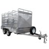 A 12x6 silver livestock trailer with a dual axle design. It includes side rails, ramps, a side door with bars, a front-mounted spare tire, tow hitch, and safety chains. Rated for 3500KG ATM.