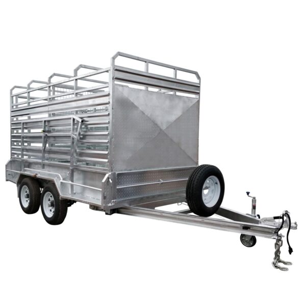 A 12x6 silver livestock trailer with a dual axle design. It includes side rails, ramps, a side door with bars, a front-mounted spare tire, tow hitch, and safety chains. Rated for 3500KG ATM.
