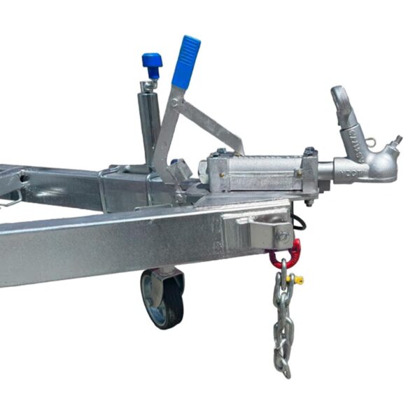 Close-up of a silver trailer hitch with a blue-handled lever on the 7×5 Single Axle Box Trailer ATM 1400KG. A small wheel and metal chain hang from the frame.
