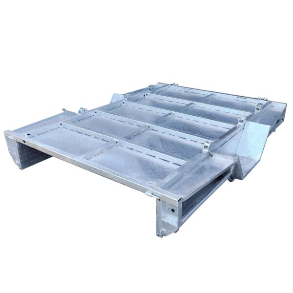 The 8×5 Single Axle Box Trailer ATM 1400KG With Jockey Wheel is a heavy-duty, industrial metal platform featuring a reinforced grid-like flat surface and raised edges, designed to support heavy machinery or equipment.