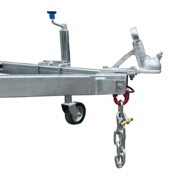 The 6x4 Single Axle Box Trailer ATM 750KG features a metallic hitch with a blue handle and is mounted on a frame with a small wheel. Below, a heavy-duty chain with a red hook hangs, and it includes a coupler for towing connections.