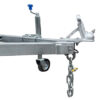 A close-up of the Premium 10x6 Dual Axle Heavy Duty Tandem Trailer’s metal hitch, featuring a wheel, chain, and blue-handled crank jack for secure trailer attachment and stabilization.