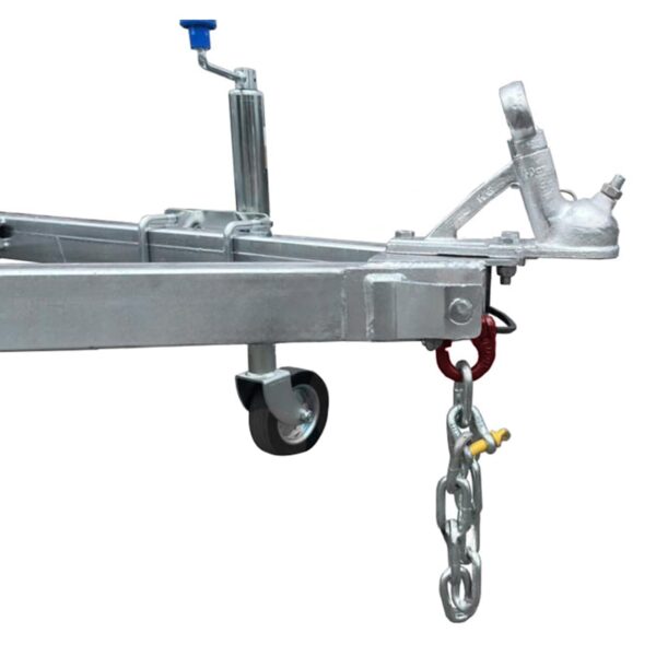 A close-up shows a metal trailer hitch with a blue handle lever on a wheel, featuring an attached safety chain and hook, designed for connecting and towing trailers. Compatible with the Premium 8x6 Dual Axle Heavy Duty Tandem Trailer - 2000KG ATM For Sale.