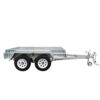 A silver 7×5 Single Axle Box Trailer with a flat cargo bed and towing hitch is designed for transporting goods. It features two wheels on each side and includes a jockey wheel, set against a plain white background. ATM 1400KG capacity.