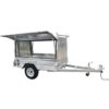 The Premium 7x5 Single Axle Tradesman Trailer features a ribbed aluminum design with an open lid, enclosed space, one wheel per side, and a front tow bar. It has a 750KG ATM.