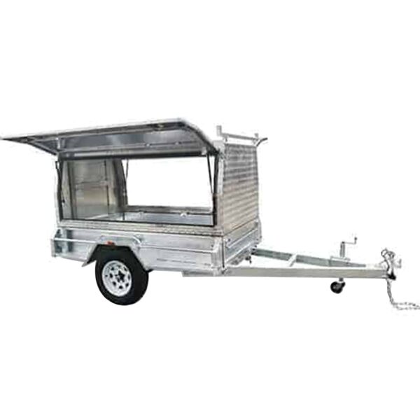 The Premium 7x5 Single Axle Tradesman Trailer features a ribbed aluminum design with an open lid, enclosed space, one wheel per side, and a front tow bar. It has a 750KG ATM.