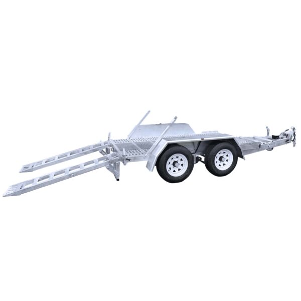 A silver utility trailer with two wheels on each side and two extended loading ramps. It has a robust, open framework design with a hitch at the front for towing. The trailer appears suitable for transporting vehicles or heavy equipment.