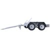 Side view of a silver, dual axle trailer with four wheels. It features a long tow bar extending outward. The trailer has a simple, utilitarian design with fenders over the wheels.