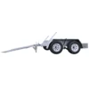 Side view of a silver dual-axle trailer with two wheels on each side. The trailer has a long tongue extending from the front, angled downwards. The design is simple, suitable for transporting goods.