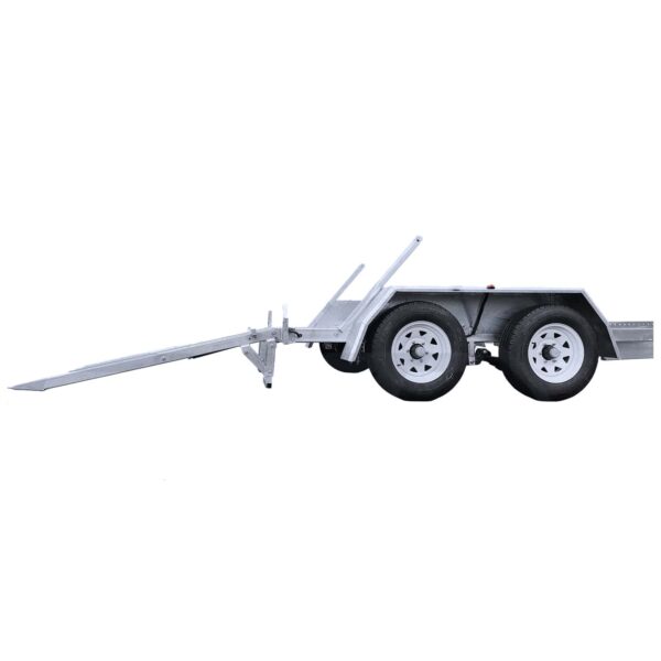 Side view of a silver, dual axle trailer with four wheels. It features a long tow bar extending outward. The trailer has a simple, utilitarian design with fenders over the wheels.
