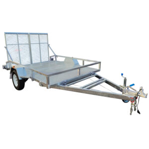 The 10x7 Heavy-Duty Trailer, viewed from an angle, features a metal frame and mesh ramp, single axle with two wheels, hitch with safety chains, and a metal floor. Ideal for transporting goods or equipment like ATVs and golf carts, it boasts a 1400KG capacity.