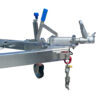 Close-up of the 10x7 Heavy-Duty ATV, Zero Turn Mower, Golf Cart, Buggy Trailer (1400KG Capacity) featuring a metal hitch with a blue-handled lever and locking mechanism, safety chain with hook attachment below, and bottom wheel for easy maneuverability.