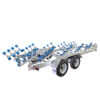 The 7.5m Galvanized Dual Axle Boat Trailer, ideal for 6.8m-7.5m boats and supporting up to 3500kg, features a silver tilting framework with dual wheels and multiple blue roller supports on a white background.