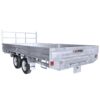 A silver Premium 14x7 Galvanized Flat Top Trailer, featuring double axles and four wheels, a front railing, and a side logo, is empty against a white background. It boasts a 3500KGS ATM and comes equipped with ramps.
