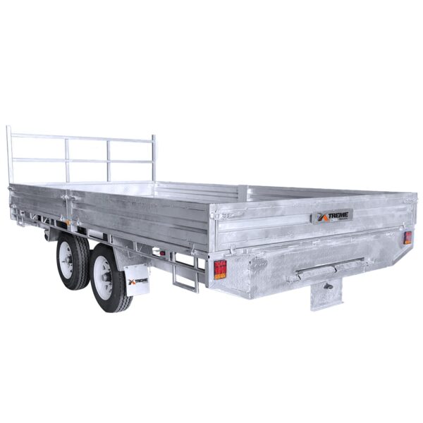 A silver Premium 14x7 Galvanized Flat Top Trailer, featuring double axles and four wheels, a front railing, and a side logo, is empty against a white background. It boasts a 3500KGS ATM and comes equipped with ramps.