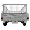 The image displays the rear view of a 10×5 Dual Axle Hydraulic Tipper Tandem Box Trailer, featuring a mesh cage frame, tail lights, mud flaps with the Xtreme Trailers logo, and two wheels. Its designed for carrying up to 3500KG of goods with ramp holders.