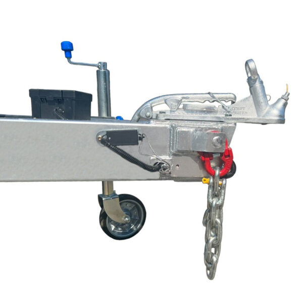Side view of the 10×5 Dual Axle Hydraulic Tipper Tandem Box Trailer - 3500KG ATM With Ramp Holders featuring a metal trailer hitch with wheel, crank handle, safety chain, and coupling for vehicle attachment.