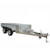 The 10×5 Dual Axle Hydraulic Tipper Tandem Box Trailer - 3500KG ATM comes with ramp holders, designed for hauling with a sturdy frame and hitch. A chain and brake cable are visible at the front.