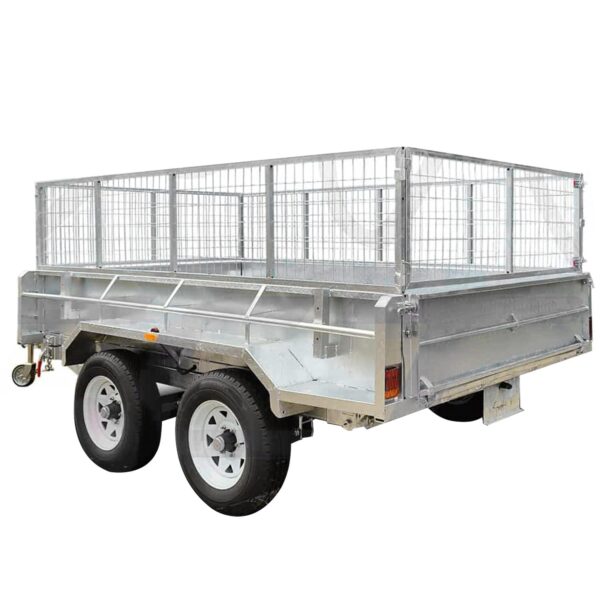 The 10×6 Dual Axle Hydraulic Tipper Tandem Box Trailer - 3500KG ATM with Ramp Holders is a silver utility trailer featuring tall wire mesh sides, a sturdy solid base, a front hitch, and dual wheels with black tires and white rims—ideal for transporting goods securely.