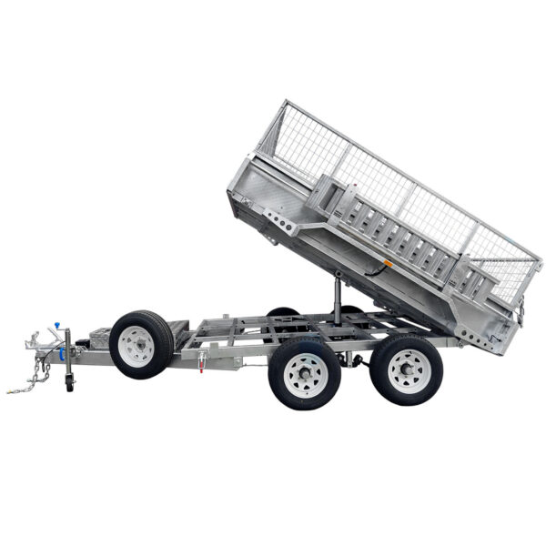 The 10×6 Dual Axle Hydraulic Tipper Tandem Box Trailer - 3500KG ATM With Ramp Holders is shown raised and tilted, featuring dual axles with four wheels, a front tow hitch, and ramp holders, ready for loading or unloading.
