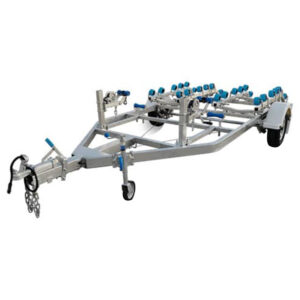The Twin Jetski Roller Trailer – ATM 1400kg is designed for easy double watercraft transport, featuring a metal frame with multiple blue padded supports, tandem axles, and a safety chain-equipped hitch.