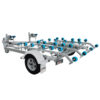 The Twin Jetski Roller Trailer features a silver metallic frame with multiple blue rollers, black tire, and visible fender. It has a single axle and is designed to safely transport small boats or two watercrafts with an ATM of 1400 kg.