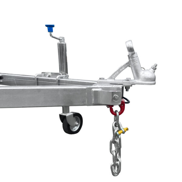 Close-up view of an 8x5 Hydraulic Tipper Single Axle Box Trailer showing a blue-handled hand crank, a red hook-attached chain, and two wheels. Emphasizes the coupling mechanism and support structure.