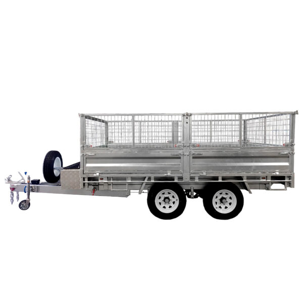The 14x7 Dual Axle Hydraulic Tipper Tandem Box Trailer - 4500KG ATM With Ramps features mesh side panels, a spare tire at the front, a tow hitch, and dual wheels on each side, making it ideal for hauling heavy cargo.