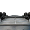 A close-up of the Premium 8x5 Dual Axle Heavy Duty Tandem Trailer (2000KG ATM, 425mm high sides) showcases its metal chassis, four black wheels, frame, axle, and diamond-plate paneling against a white background.