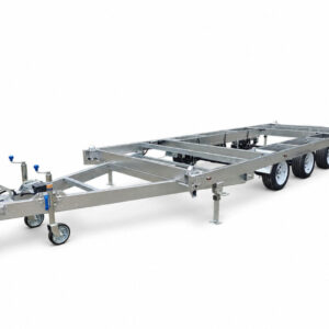 A Premium 20ft Tri-Axle Container Trailer 4500KG ATM (Pre-order), featuring a galvanized steel chassis with three wheels per side, a front tow hitch, and support stands, designed for heavy loads or tiny home foundations, is shown on a white background.