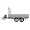 A Premium 10x7 Galvanized Flat Top Trailer with 4500KGS ATM (Pre-order), featuring a dual-axle design, mesh ramp, spare tire mounted on the front left side, and sturdy metal side panels, shown from the side against a white background.