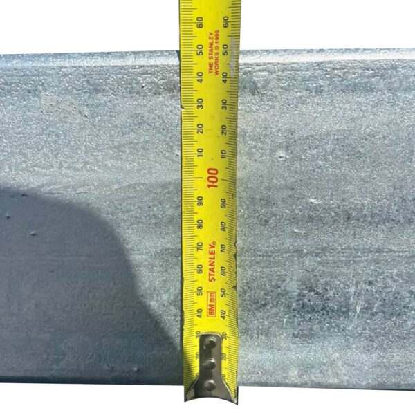 A Premium 10x7 Galvanized Flat Top Trailer with 4500KGS ATM (Pre-order) is measured vertically to 100 centimeters against a metallic surface using a yellow Stanley tape measure, with the tape’s numbers clearly visible in black and red.