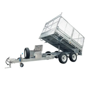 A Premium 12×7 Hydraulic 3-Way Tipper Galvanised Flat Top Trailer (4500kg ATM, Pre-order) featuring dual axles, a raised tilting cargo bed, mesh side panels, a spare tire, and a tool box mounted near the hitch.