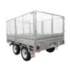 A Premium 12×7 Dual Axle Hydraulic Tipper Tandem Box Trailer – 4500KG ATM (Pre-order) is shown from a rear side angle. The silver metal trailer features high wire mesh sides, two axles with four wheels, and an empty bed designed for transporting goods or equipment.