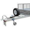 A close-up view of the front part of the Premium 8x5 Dual Axle Heavy Duty Tandem Trailer – 425mm High Sides, 3500KG ATM (Pre-order), featuring a spare tire, safety chains, and a swivel caster wheel attached to the trailer’s tongue. The mesh side panels are visible in the background.