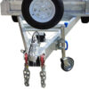 Close-up of the front section of the Premium 8x5 Dual Axle Heavy Duty Tandem Trailer – 425mm High Sides 3500KG ATM, featuring a robust metal trailer hitch with safety chains, a wheel jack, a conveniently mounted spare tire above, and a secure coupling mechanism.