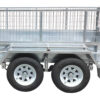 A close-up side view of the Premium 8x5 Dual Axle Heavy Duty Tandem Trailer—featuring two black tires with white rims and 425mm high wire mesh sides. This 3500KG ATM trailer is built for durability and ideal for transporting goods or equipment.