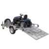 An 8×5 Heavy-Duty ATV, Zero Turn Mower, Golf Cart, Buggy Trailer – 750KG ATM with its ramp lowered to the ground holds a blue riding lawn mower, ready for loading or unloading.