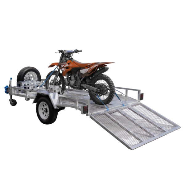 An 8×5 Heavy-Duty ATV, Zero Turn Mower, Golf Cart, Buggy Trailer – 750KG ATM with a metal mesh ramp extended to the ground secures a brown dirt bike, and features a spare tire mounted on the side.