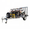A metal 8×5 Heavy-Duty ATV, Zero Turn Mower, Golf Cart, Buggy Trailer – 750KG ATM is loaded with three dirt bikes, a mounted spare tire, a yellow fuel container, and features a metal ramp at the rear—all isolated on a white background.