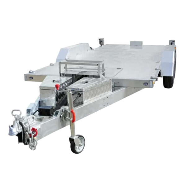 Premium Hydraulic Tipper Car Trailer 4200kg ATM with a 16.4×6.6FT (5x2M) flat deck, featuring a front toolbox, wheel chocks, loading ramps, and a hitch jack on a caster wheel. This trailer is equipped with two tires and reflective side lights.