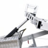 Close-up of a hydraulic piston attached to the metal frame of the Premium Hydraulic Tipper Car Trailer 4200kg ATM 16.4×6.6FT (5x2M) Deck Size (Pre-order), likely part of its lifting or tilting mechanism, with a diamond-plate metal box and black hose visible against a plain white background.