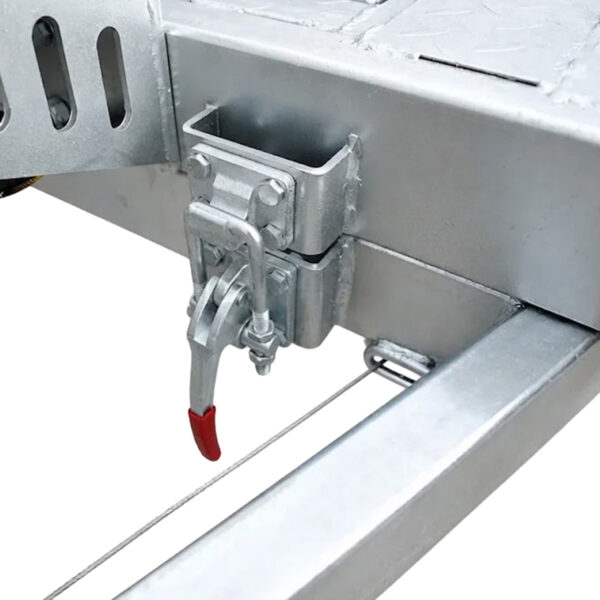 Close-up of a metal latch mechanism with a red-tipped handle, mounted on the galvanized frame of the Premium Hydraulic Tipper Car Trailer 4200kg ATM 16.4×6.6FT (5x2M) Deck Size (Pre-order), set against a white background.