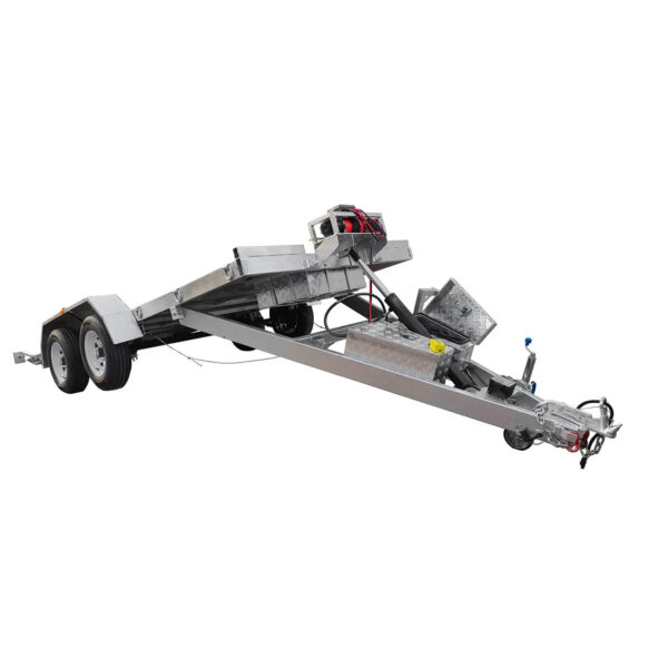 The Premium Hydraulic Tipper Car Trailer 4200kg ATM features a 16.4x6.6FT (5x2M) punched aluminum floor deck, dual axles, open toolboxes, and a front hitch. The trailer is shown with its bed tilted in the loading position, revealing the hydraulic lift mechanism underneath.